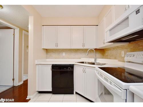 103-25 Meadow Lane, Barrie, ON - Indoor Photo Showing Kitchen With Double Sink