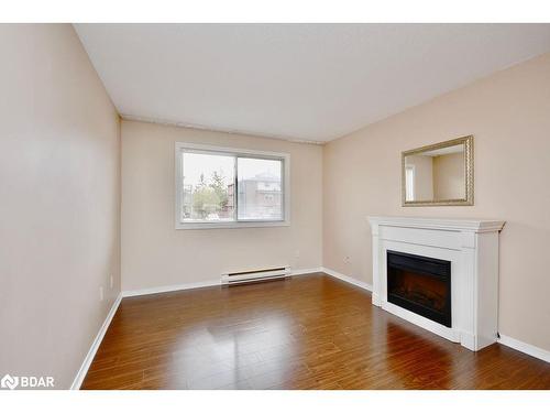 103-25 Meadow Lane, Barrie, ON - Indoor Photo Showing Living Room With Fireplace