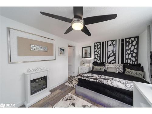 64 O'Shaughnessy Crescent, Barrie, ON - Indoor Photo Showing Bedroom With Fireplace