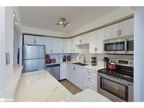 606-2301 Derry Road W, Mississauga, ON - Indoor Photo Showing Kitchen With Stainless Steel Kitchen With Double Sink