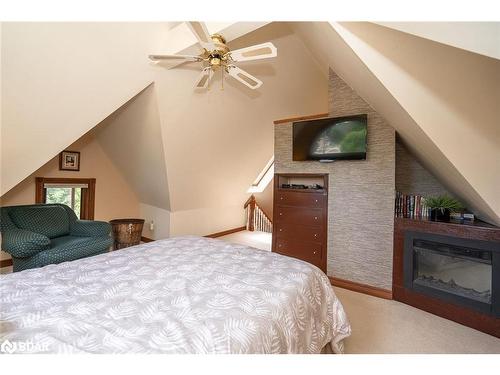 102 Wellington Street E, Alliston, ON - Indoor Photo Showing Bedroom With Fireplace