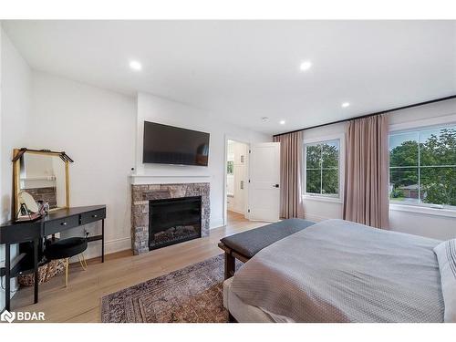 660 Mapleview Drive E, Innisfil, ON - Indoor Photo Showing Bedroom With Fireplace