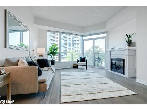 405-37 Ellen Street, Barrie, ON - Indoor Photo Showing Living Room With Fireplace