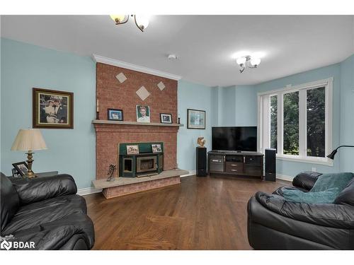 433143 4 Line, Amaranth, ON - Indoor Photo Showing Living Room With Fireplace