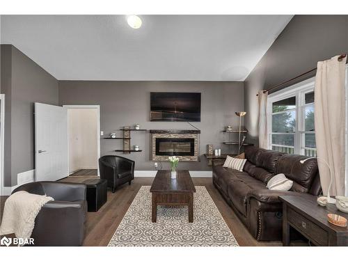 433143 4 Line, Amaranth, ON - Indoor Photo Showing Living Room With Fireplace