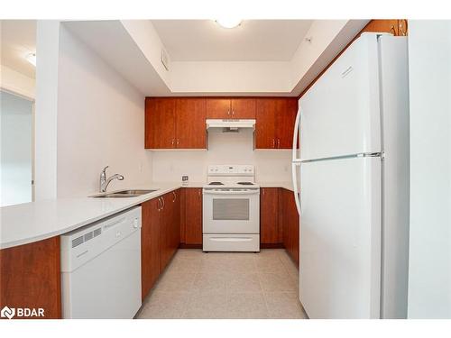 610-302 Essa Road, Barrie, ON - Indoor Photo Showing Kitchen With Double Sink