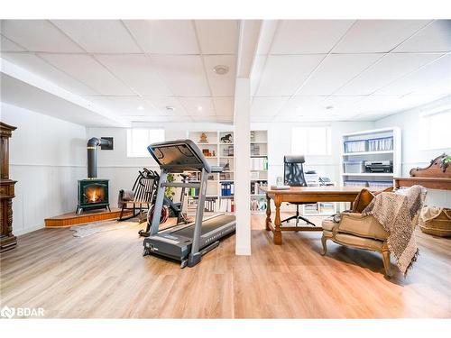 15 Parklane Court, Tiny, ON - Indoor Photo Showing Gym Room With Fireplace