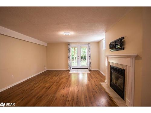 59 Livingstone Street E, Barrie, ON - Indoor Photo Showing Living Room With Fireplace