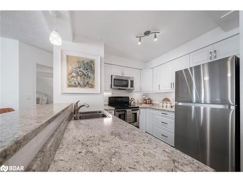 603-150 Dunlop Street E, Barrie, ON - Indoor Photo Showing Kitchen With Stainless Steel Kitchen With Double Sink With Upgraded Kitchen