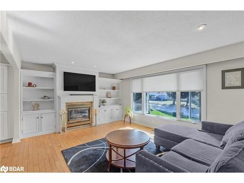 12 Roslyn Road, Barrie, ON - Indoor Photo Showing Living Room With Fireplace