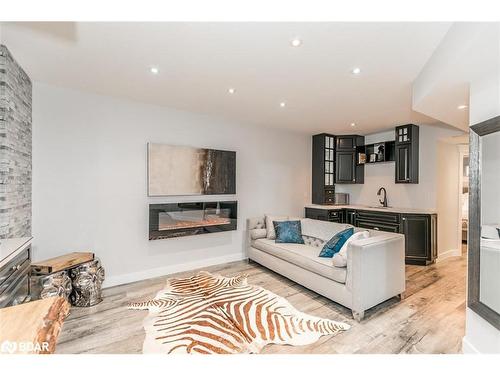 11 Oakmont Avenue, Horseshoe Valley, ON - Indoor Photo Showing Living Room With Fireplace