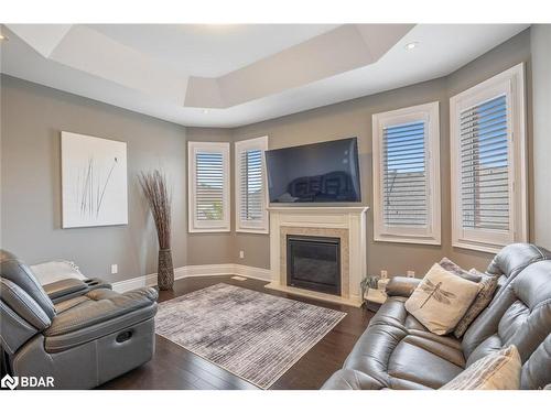 3045 Orion Boulevard, Orillia, ON - Indoor Photo Showing Living Room With Fireplace