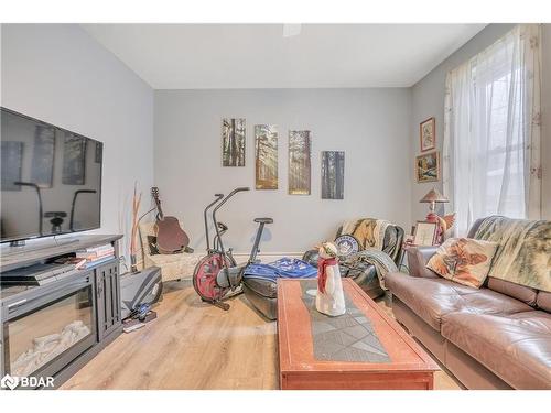 8 Maria Street, Elmvale, ON - Indoor Photo Showing Living Room With Fireplace