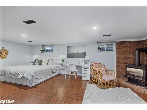 101 Queen Street, Barrie, ON - Indoor Photo Showing Bedroom With Fireplace