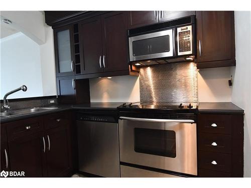 609-140 Dunlop Street E, Barrie, ON - Indoor Photo Showing Kitchen With Double Sink