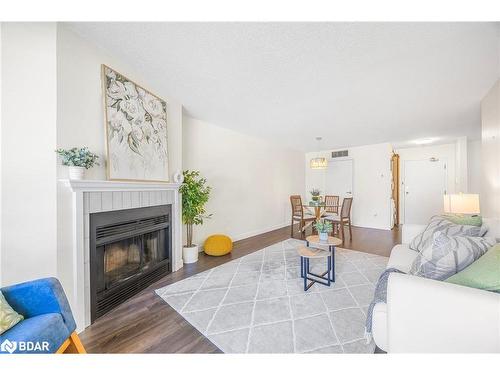 214-126 Bell Farm Road, Barrie, ON - Indoor Photo Showing Living Room With Fireplace