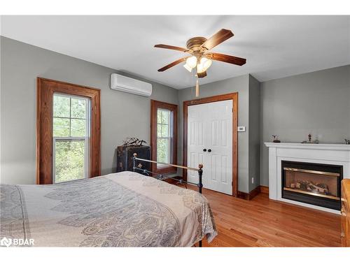 2378 Old Second Road North Road, Elmvale, ON - Indoor Photo Showing Bedroom With Fireplace