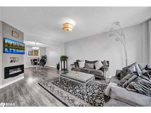 4 Berkar Street, Angus, ON - Indoor Photo Showing Living Room With Fireplace