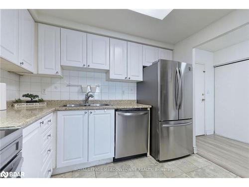 1013-135 Hillcrest Avenue, Mississauga, ON - Indoor Photo Showing Kitchen With Stainless Steel Kitchen With Double Sink