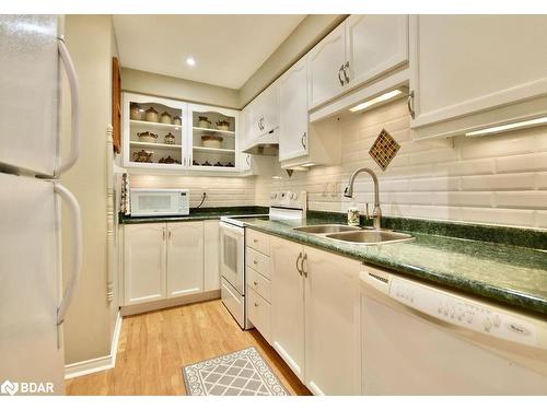 10-492 Laclie St Street, Orillia, ON - Indoor Photo Showing Kitchen With Double Sink