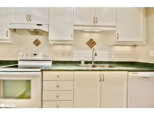 10-492 Laclie St Street, Orillia, ON - Indoor Photo Showing Kitchen With Double Sink