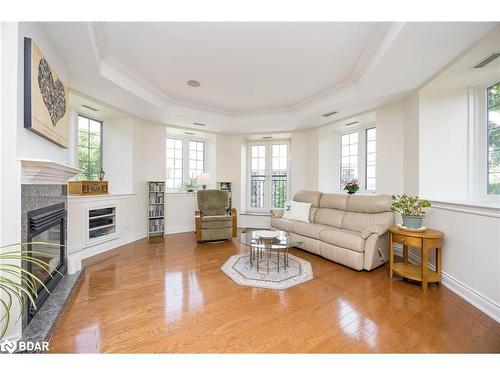 401-200 Collier Street, Barrie, ON - Indoor Photo Showing Living Room With Fireplace