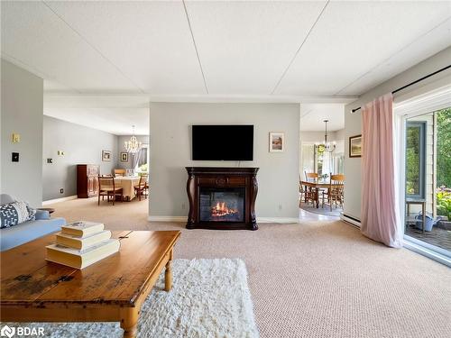 107-330 Brewery Lane, Orillia, ON - Indoor Photo Showing Living Room With Fireplace