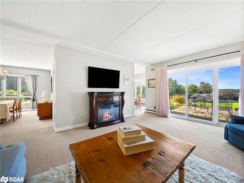 107-330 Brewery Lane, Orillia, ON - Indoor Photo Showing Living Room With Fireplace