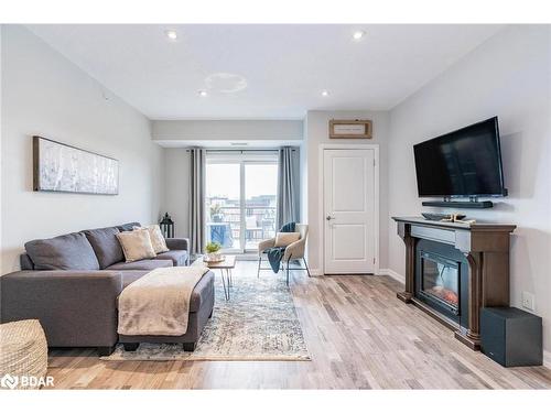 603-302 Essa Road, Barrie, ON - Indoor Photo Showing Living Room With Fireplace