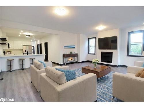 B-23 Gray Street, Coldwater, ON - Indoor Photo Showing Living Room With Fireplace