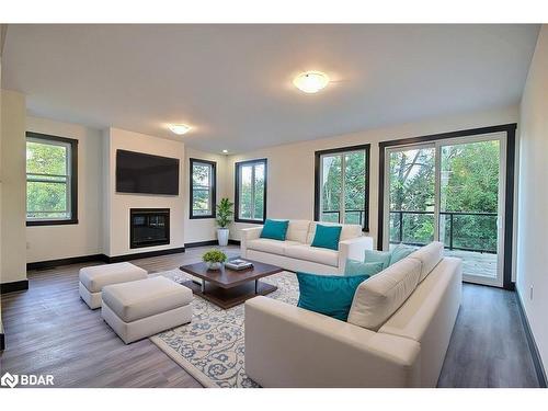 B-23 Gray Street, Coldwater, ON - Indoor Photo Showing Living Room With Fireplace