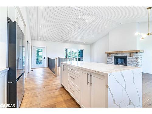 33 Coshs Road, Bobcaygeon, ON - Indoor Photo Showing Kitchen With Fireplace