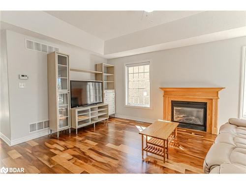 121 Sovereigns Gate, Barrie, ON - Indoor Photo Showing Living Room With Fireplace