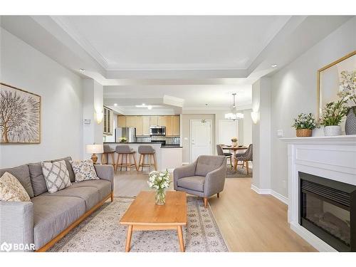 420-3351 Cawthra Road, Mississauga, ON - Indoor Photo Showing Living Room With Fireplace