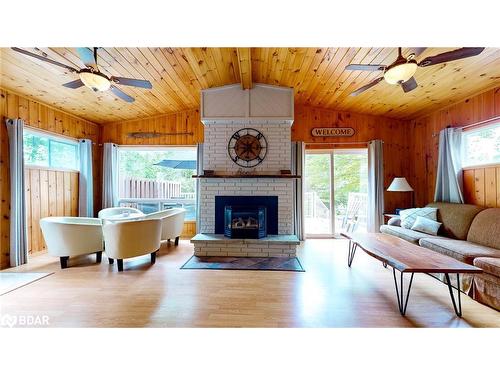 2229 Tiny Beaches Road S, Tiny, ON - Indoor Photo Showing Living Room With Fireplace