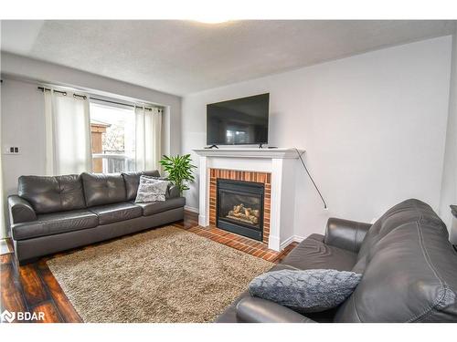 30 Aikens Crescent, Barrie, ON - Indoor Photo Showing Living Room With Fireplace