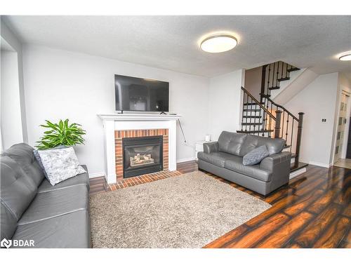 30 Aikens Crescent, Barrie, ON - Indoor Photo Showing Living Room With Fireplace