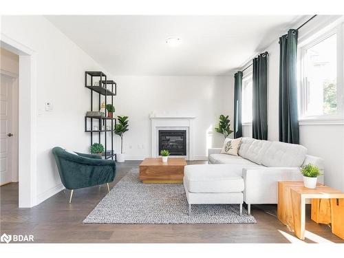 102 Wood Crescent, Angus, ON - Indoor Photo Showing Living Room With Fireplace