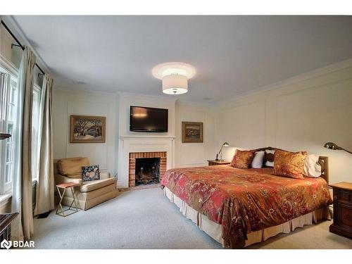 181 Peter Street N, Orillia, ON - Indoor Photo Showing Bedroom With Fireplace