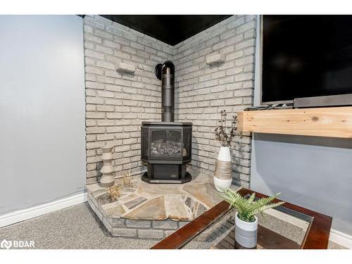 15 Bristow Court, Barrie, ON - Indoor With Fireplace