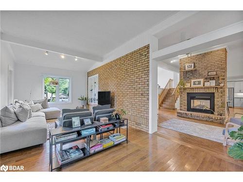 8 Frid Boulevard, Midhurst, ON - Indoor Photo Showing Living Room With Fireplace