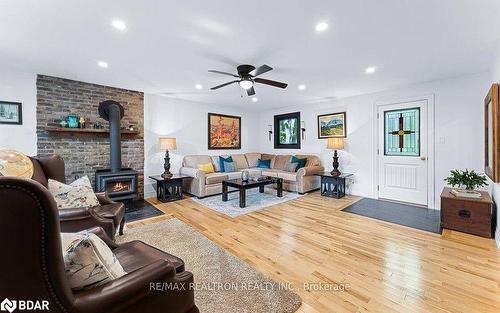 6 Mill Street E, Springwater, ON - Indoor Photo Showing Living Room With Fireplace