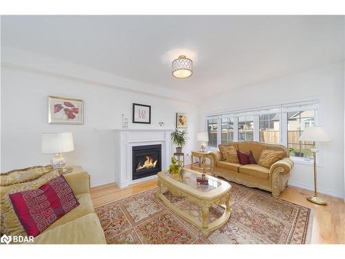 1002 Larter Street, Innisfil, ON - Indoor Photo Showing Living Room With Fireplace