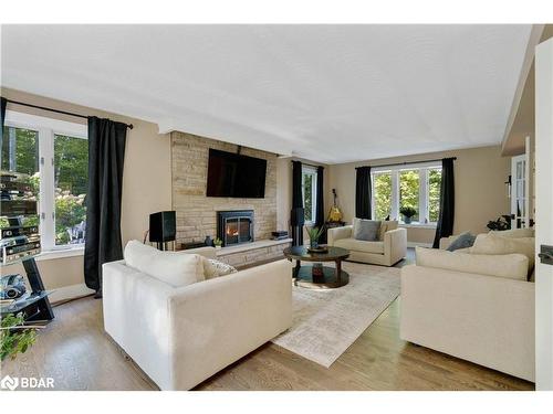 11 Park Trail, Midhurst, ON - Indoor Photo Showing Living Room With Fireplace