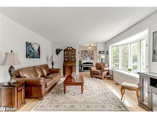 30 The Granite Bluff, Bracebridge, ON - Indoor Photo Showing Living Room With Fireplace