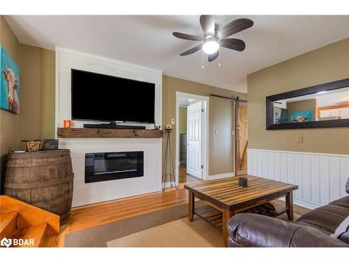 14308 County 27 Road, Springwater, ON - Indoor Photo Showing Living Room With Fireplace