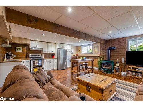 14308 County 27 Road, Springwater, ON - Indoor Photo Showing Living Room With Fireplace