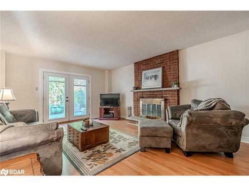 12 Moore Place, Barrie, ON - Indoor Photo Showing Living Room With Fireplace