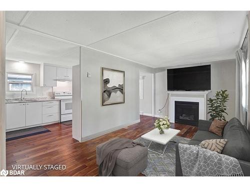 59 Hawthorne Drive, Innisfil, ON - Indoor Photo Showing Living Room With Fireplace