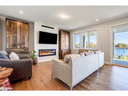 7 Dock Lane, Port Mcnicoll, ON - Indoor Photo Showing Living Room With Fireplace